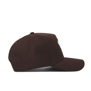 The Western Carolina Americano Hat is displayed from the side, showcasing its structured fit, dark brown color, curved brim, and visible stitching on a white background.