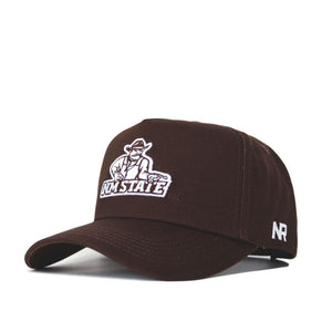 The New Mexico State Americano Hat is a brown baseball cap with the NM State logo and cowboy mascot embroidered on the front, "NR" on the brim, and an adjustable snapback closure. Made from high-quality cotton and officially licensed.