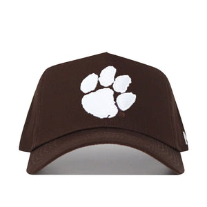The Clemson Americano Hat is a brown cotton baseball cap with a large white paw print on the front and an adjustable snapback for a custom fit.