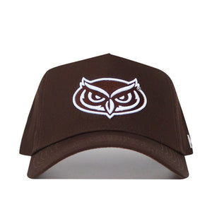The Florida Atlantic (FAU) Americano Hat is a brown snapback featuring a white outlined owl face logo embroidered on the front. Made from high quality cotton, this structured cap is shown facing forward on a plain white background.