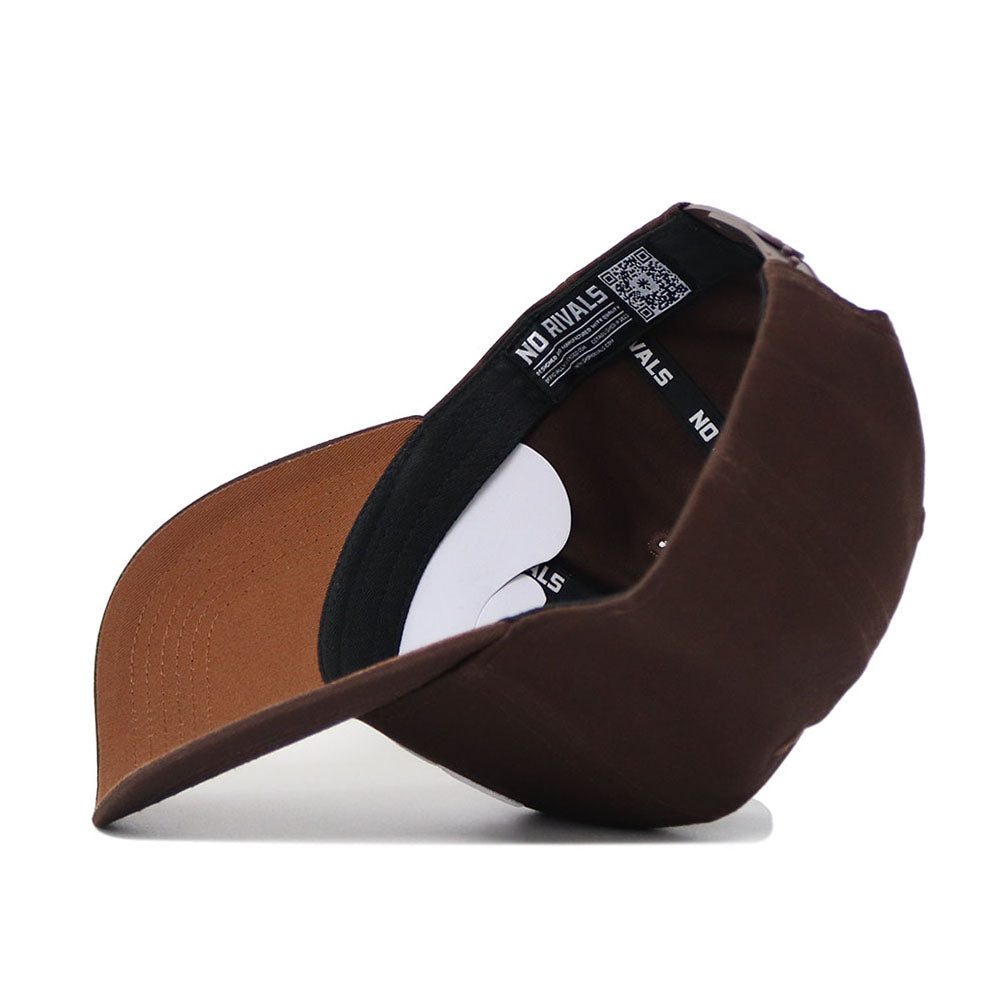 The Kansas State Americano Hat, a brown cotton baseball cap, is shown upside down to display its black sweatband with white NO RIVALS text and an adjustable back strap.