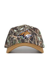 The Montana State Camo Hat - Explorer Edition features a camo design with a tan brim, an embroidered wildcat head logo outlined in white on the front, and is made from high-quality cotton for a structured fit.