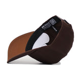 The Memphis Americano Hat is a brown, high-quality cotton baseball cap with a structured fit, black sweatband with white text, QR code near the adjustable strap, and visible underside brim and inside lining.