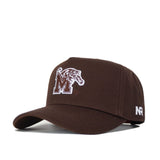 The Memphis Americano Hat is a brown cotton snapback with a white embroidered M and tiger logo on the front, plus white NR initials stitched on the side.
