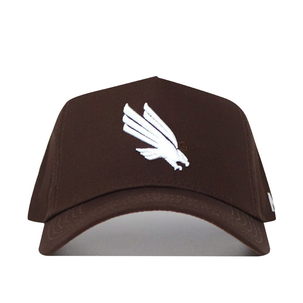 The North Texas Americano Hat is a brown cotton baseball cap featuring a white embroidered bird logo, structured fit, curved brim, and detailed stitching for a premium appearance.