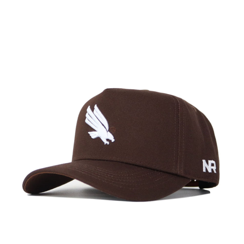 The North Texas Americano Hat is a brown cotton baseball cap with a white embroidered bird logo on the front, structured fit, and white NR initials on the left side.