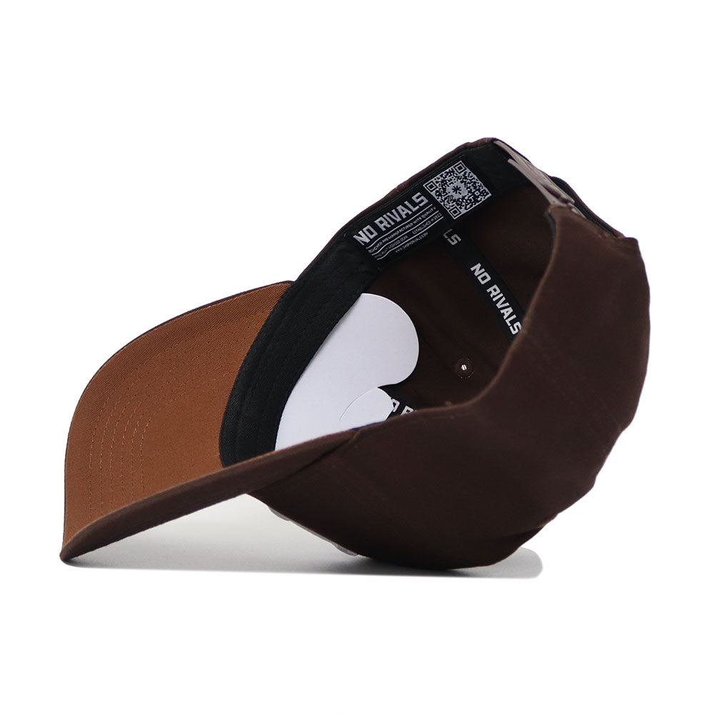 The Nebraska Americano Hat is shown inside out, revealing its black inner band with white NO RIVALS text and size label, plus the underside of the brim. Made from high-quality cotton for a structured fit.