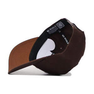 The Nebraska Americano Hat is shown inside out, revealing its black inner band with white NO RIVALS text and size label, plus the underside of the brim. Made from high-quality cotton for a structured fit.