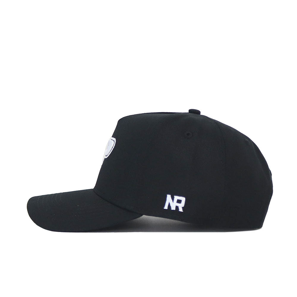 The Purdue Americano Hat is a black snapback, shown from the side, with white NR embroidery on the back and a small round patch on the front. Made from high-quality cotton, it offers a structured fit for lasting style.