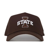 The Iowa State Americano Hat is a structured brown cotton baseball cap featuring a bold white "I" and "STATE" embroidered on the front.