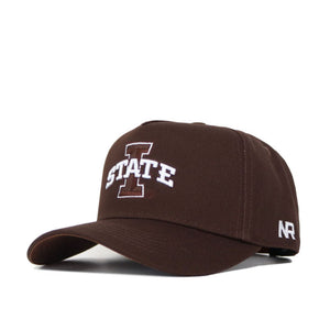 The Iowa State Americano Hat is a brown cotton snapback cap with a curved brim, featuring a large white I and STATE embroidered on the front, NR on the left side, and a structured fit for style and comfort.