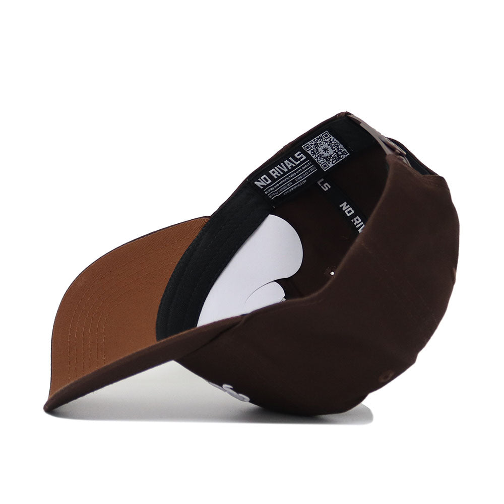 The Penn State Americano Hat is shown upside down, revealing its inner lining with NO RIVALS text and a QR code on the black band. Made from quality cotton, it features a curved brim and an adjustable snapback.