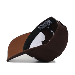 The Penn State Americano Hat is shown upside down, revealing its inner lining with NO RIVALS text and a QR code on the black band. Made from quality cotton, it features a curved brim and an adjustable snapback.
