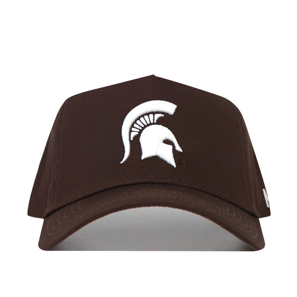 The Michigan State Americano Hat is a brown, structured baseball cap made from high-quality cotton, featuring a white Spartan helmet logo on the front.