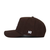 The Michigan State Americano Hat is a brown baseball cap with a structured fit, curved brim, and white NR initials embroidered on the back side panel.
