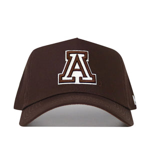 The University of Arizona Americano Hat is a brown cotton baseball cap with a large white and brown outlined "A" embroidered on the front, displayed against a plain white background.