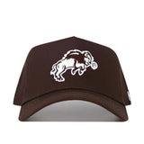 The NDSU Americano Hat is a brown snapback baseball cap with an embroidered white bison mascot holding a ball on the front, made from high-quality cotton for comfort and durability.