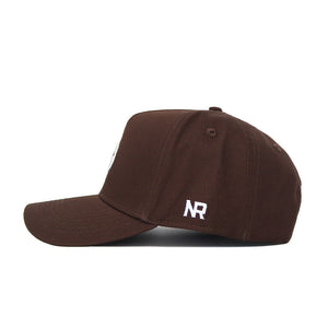 The Louisville Americano Hat is a brown, structured baseball cap shown from the side, with white embroidered NR initials above the brim on the left.