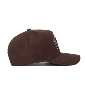 The University of Las Vegas (UNLV) Americano Hat is a brown structured-fit cap with a curved brim, raised front stitching, quality cotton build, ventilation eyelets, and a top button, shown here in a side view.