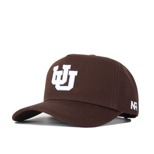 The Utah Americano Hat is a brown structured fit cap crafted from high quality cotton and features a white logo.