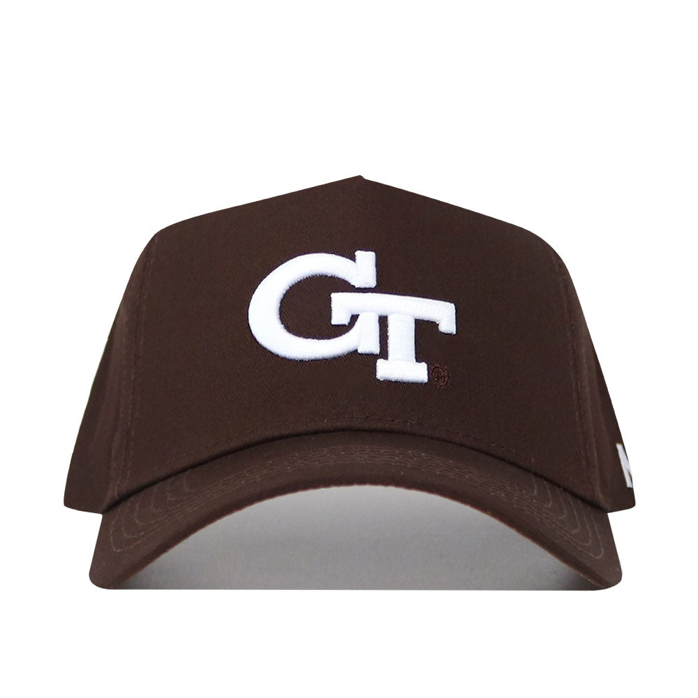 The Georgia Tech Americano Hat is a brown, high-quality cotton baseball cap with a white embroidered GT logo on the front. This structured snapback is displayed from the front against a white background.