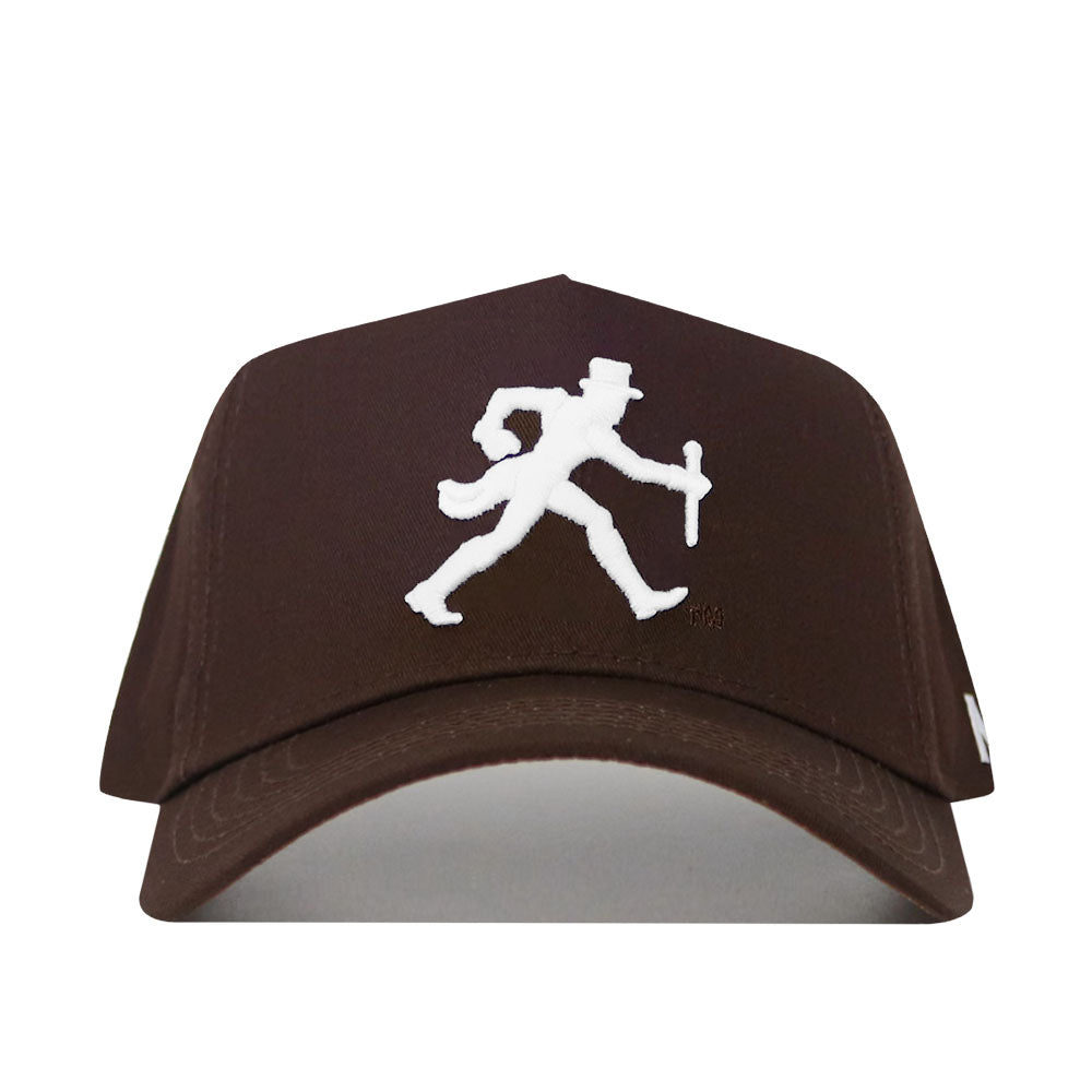The Wake Forest Americano Hat is a brown snapback made from high-quality cotton, featuring a white embroidered man in a top hat walking with a cane on the front.