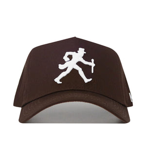 The Wake Forest Americano Hat is a brown snapback made from high-quality cotton, featuring a white embroidered man in a top hat walking with a cane on the front.