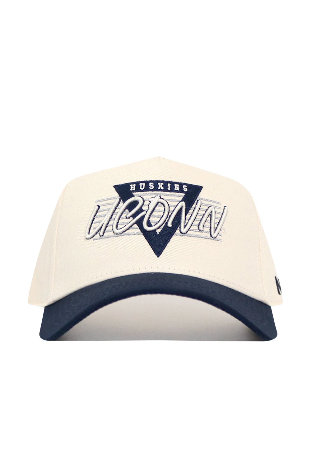 The UConn Triangle Game Cap Hat is a structured white cotton baseball cap with a navy brim, featuring a triangular "HUSKIES" patch above large embroidered "UCONN" text on the front.
