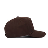 The South Carolina Americano Hat is a brown snapback with a curved brim, structured fit, and adjustable back strap. Made from high-quality cotton for lasting comfort, shown here from the side.