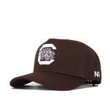 The South Carolina Americano Hat is a dark brown snapback with a large white C and gamecock logo on the front, NR letters in white on the side, and high-quality cotton construction for a structured fit.