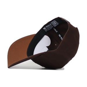 The App State Americano Hat, a brown snapback, is shown upside down to display the "NO RIVALS" text on its inner band, brown brim, structured fit, and curved visor.