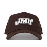 The JMU Americano Hat is a brown snapback featuring "JMU" embroidered in white block letters with black outline on the front. This structured cap offers durability and comfort with its high-quality cotton material.