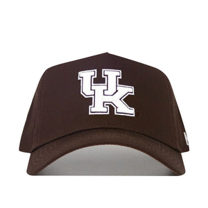 The Kentucky Americano Hat is a brown snapback made from high-quality cotton with bold white embroidered "UK" letters on the front, shown against a plain white background.