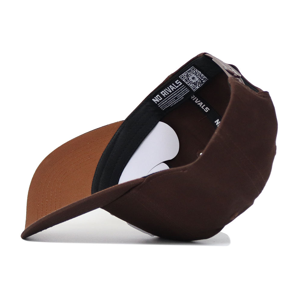 The Kentucky Americano Hat is shown upside down, revealing its black inner band with "NO RIVALS" in white, a QR code, and white cardboard inserts. The curved brim and crown are made from high-quality cotton for a structured fit.