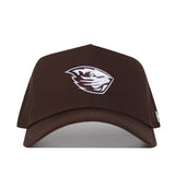 The Oregon State Americano Hat is a brown snapback made from high-quality cotton, featuring a white embroidered beaver head logo on the front, shown from the front against a plain white background.