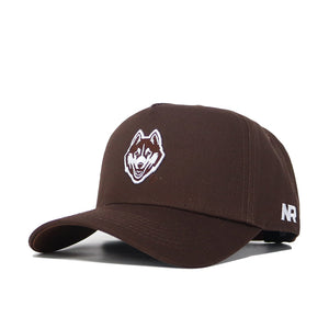 The UConn Americano Hat is a brown snapback made of high-quality cotton, featuring an embroidered wolf head logo on the front and white NR letters on the side for a structured fit.
