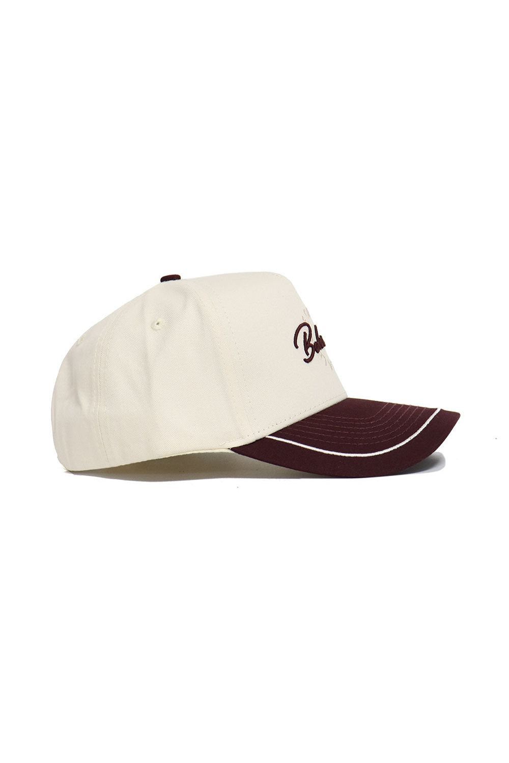 The Texas State Bobcats ALOYO Hat by No Rivals is a cream snapback with a maroon brim, maroon embroidered front text, and a white accent line along the edge. Made from high quality cotton. Side view shown.