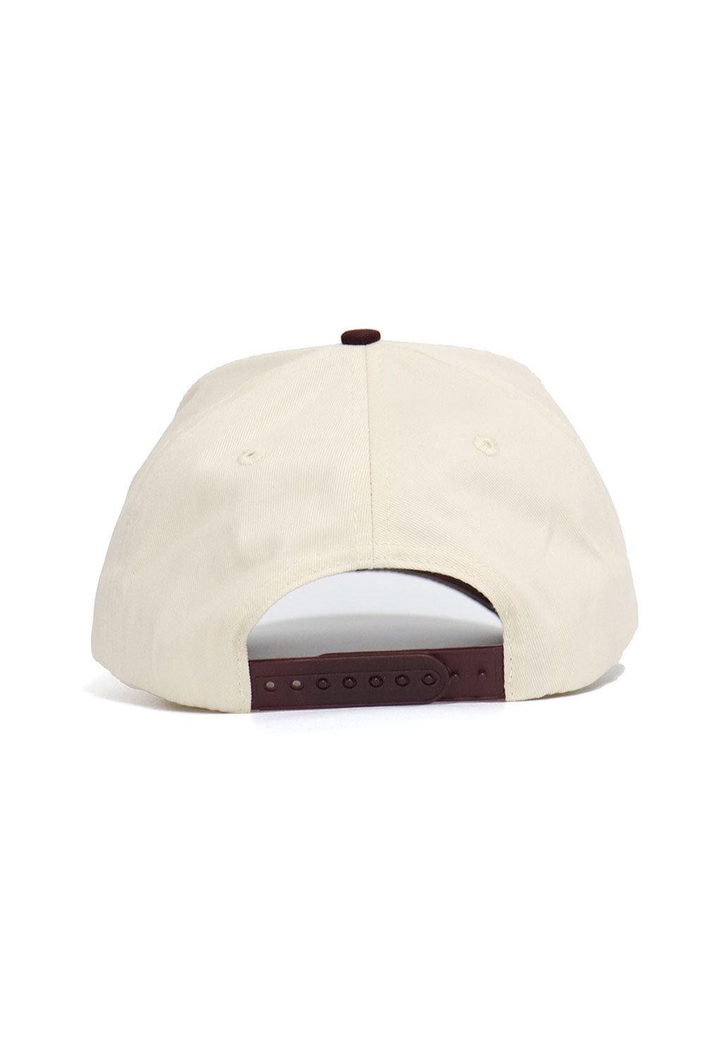 The Texas State Bobcats ALOYO Hat by No Rivals is a beige snapback shown from the back, featuring a brown adjustable strap, two small ventilation eyelets, and is made from high-quality cotton for lasting comfort.