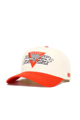 The Oregon State Triangle Game Cap Hat is a cream snapback with an orange brim and top button. It features "BEAVERS" and "Varsity State" over a large red V on the front, small red NR initials on the side, and a structured fit for lasting style.