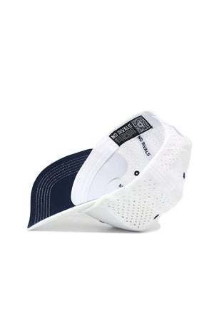 The Nevada Gameday Hat is a white perforated snapback with a dark blue underside and NO RIVALS text on the inner band, shown on its side to display the inside and part of the brim—perfect for your next gameday look.