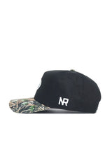 The No Rivals Mizzou Logo Camo Hat - Trailblazer Edition is a black cotton cap with a camo brim and white NR embroidery on the side, displayed in profile against a white background.