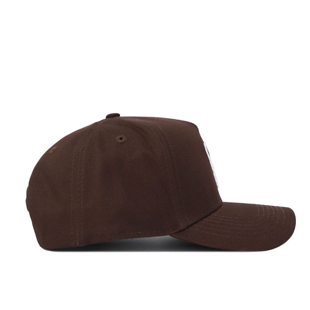 The NC State Americano Hat is shown from the side against a white background. This brown snapback hat features six panels, a curved brim, and is crafted from high-quality cotton.