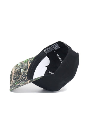 The Mizzou Logo Camo Hat - Trailblazer Edition by No Rivals is a black snapback cap shown upside down, displaying a camo-patterned brim and an interior NO RIVALS label. Made from high-quality cotton for comfort and style.