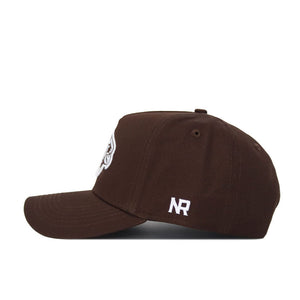 The Illinois State University Americano Hat is a brown cotton snapback shown in side view, featuring white embroidered NR letters near the back and a partially visible front logo, offering a structured fit.