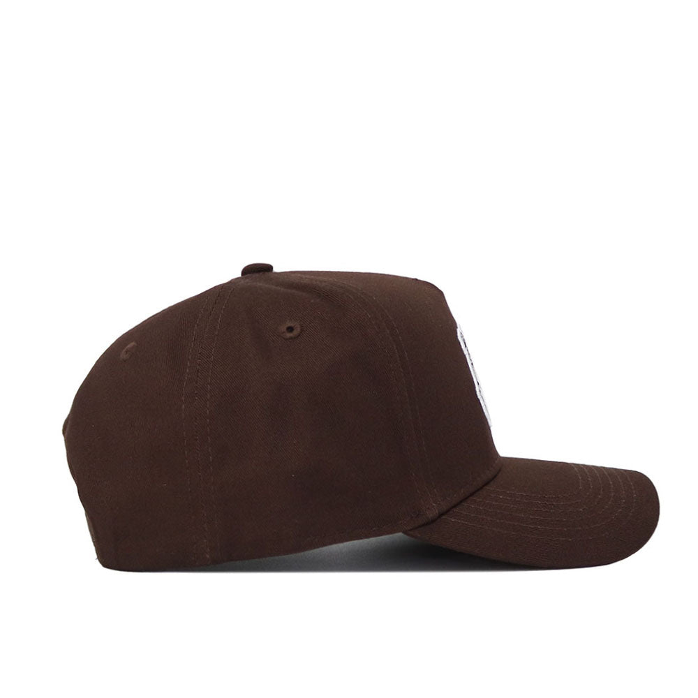 The Fresno State Americano Hat, a brown high-quality cotton baseball cap, is shown from the side on a white background. It features a curved brim, structured fit, and classic crown.