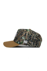 The No Rivals ECU Camo Hat - Explorer Edition is a high-quality cotton snapback with a camouflage pattern, brown brim, and white NR letters embroidered on the side, shown in side profile.
