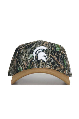 The No Rivals Michigan State Camo Hat - Explorer Edition features a white Spartan helmet logo, tan brim, and snap back closure. Made from high quality cotton for comfort and durability.