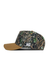 Side view of the Michigan State Camo Hat - Explorer Edition by No Rivals, featuring a brown suede bill, camouflage cotton crown, white "NR" side embroidery, and an adjustable snap back.