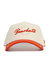 The No Rivals SHSU Bearkats ALOYO Hat features a cream and orange snapback design with "Bearkats" embroidered in orange on the front and "LEAGUE OF YOUR OWN" stitched around it. Made from quality cotton, it has an orange visor with cream trim for structure.