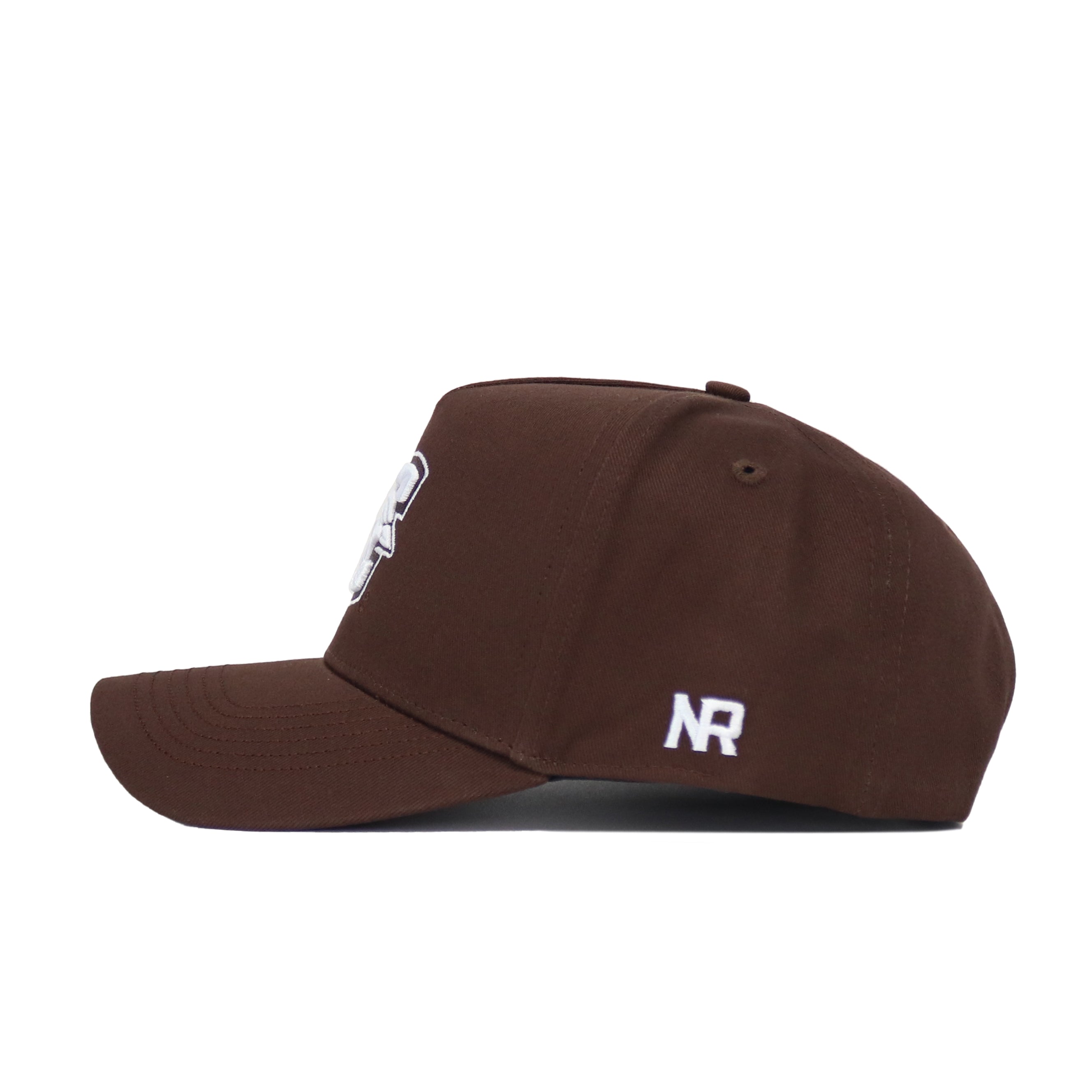 The Creighton Americano Hat is a brown snapback seen from the side, with a white NR logo embroidered near the back and a partially visible front graphic, crafted from high quality cotton.